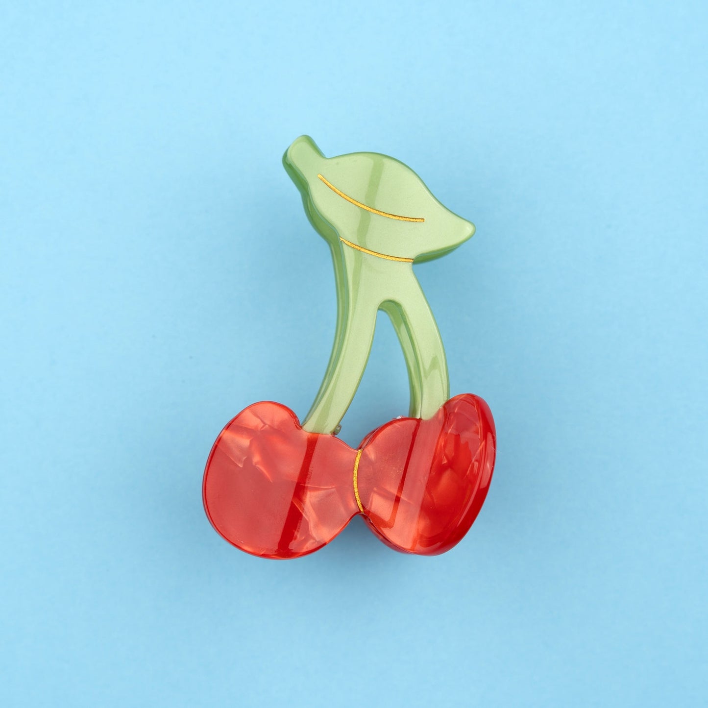 Tolle Haarspange in Form einer Kirsche mit schimmerndem rot und gruen. Ideal für etwas fruchtiges im Haar.