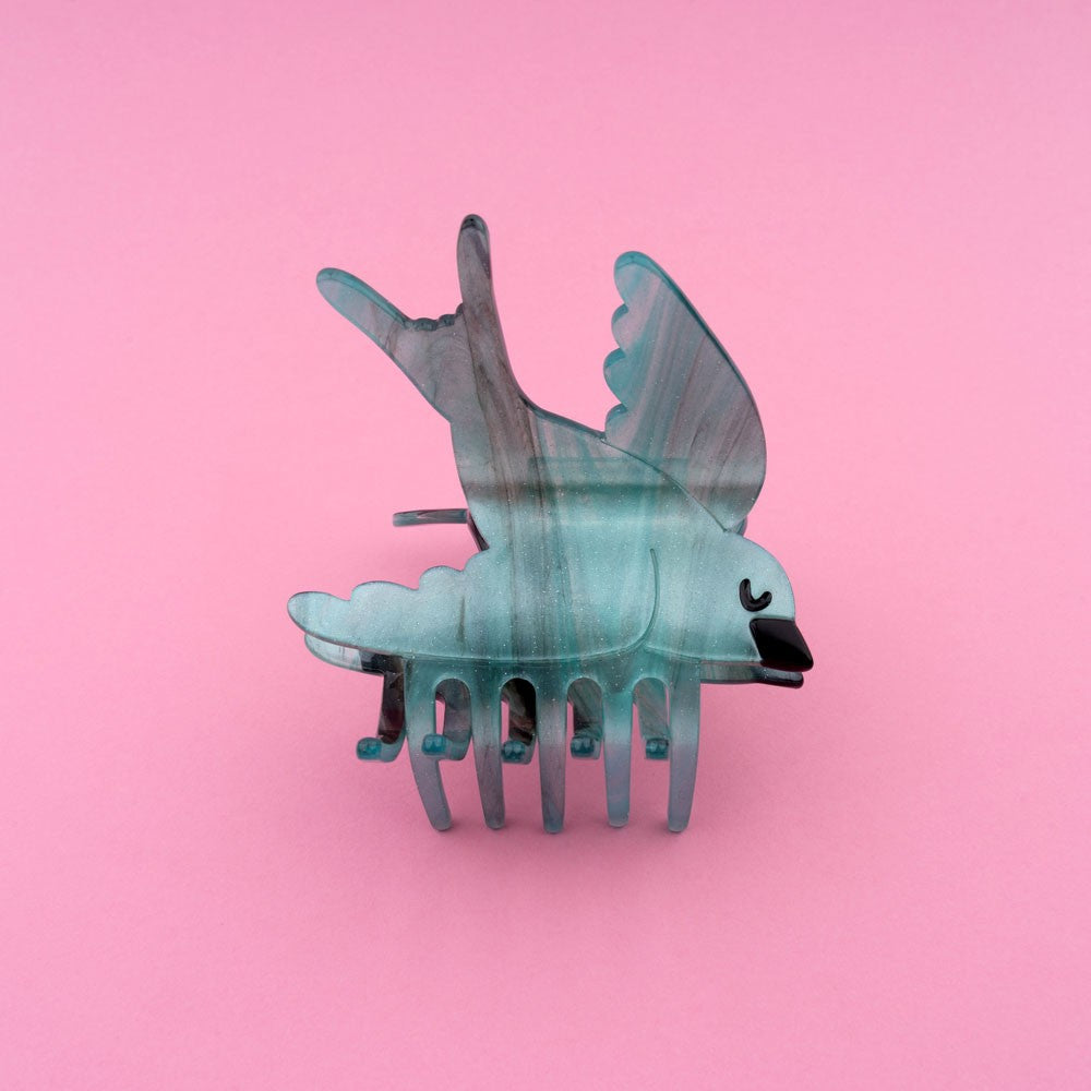 Fliegende friedliche Schwalben Haarklammer mit blau schimmernder Struktur und ein Hauch von Glitzer Elementen