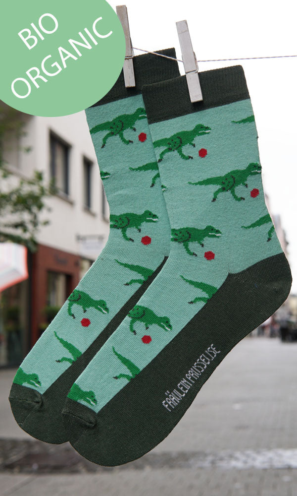 Tragefoto von den Prusselise Damensocken mit coolem T Rex Muster in gruen.