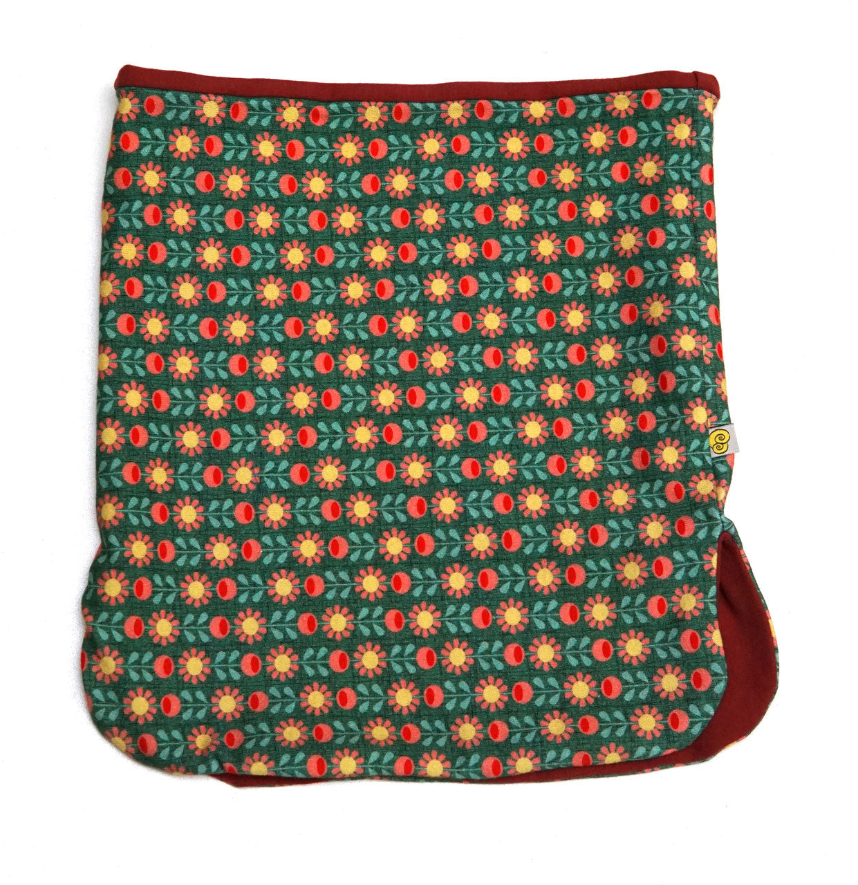 Loop Schal für Kinder mit Retroblumenmuster, in den Farben gruen, gelb, peach. Innen weinroter Jersey.