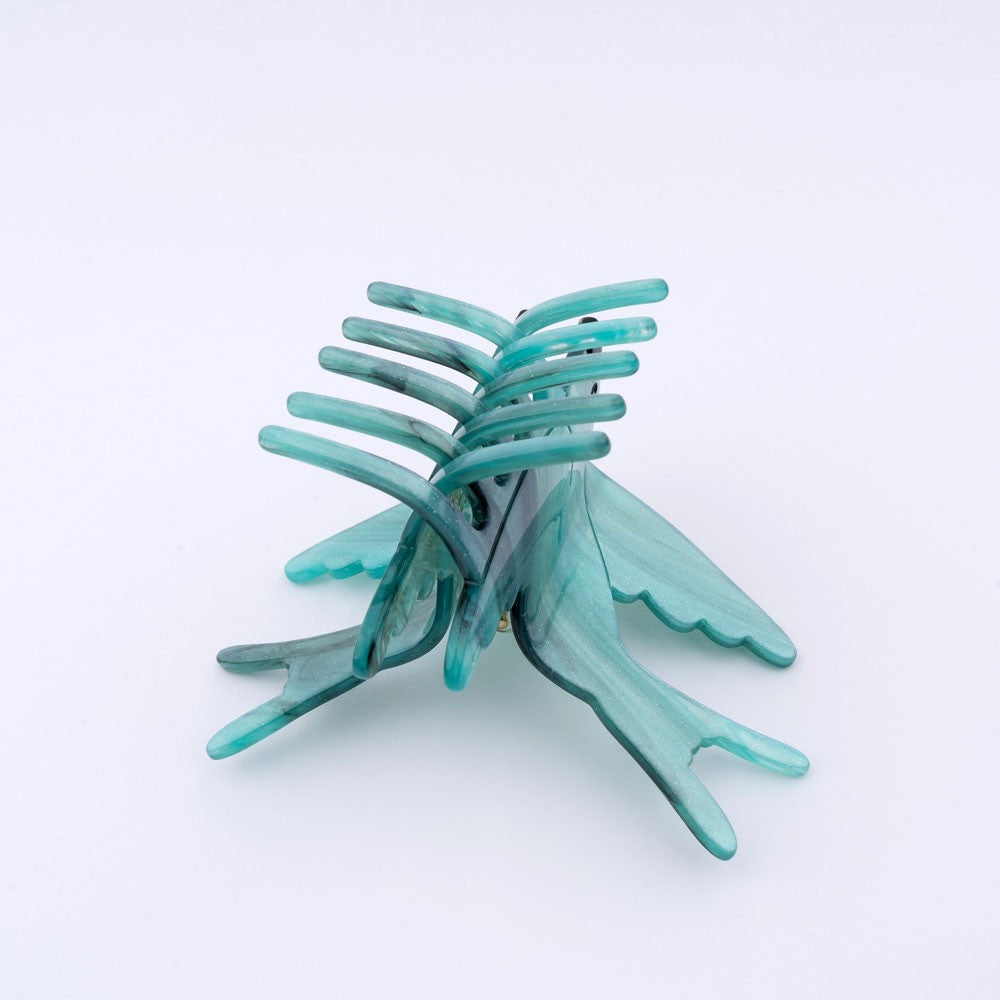 Fliegende friedliche Schwalben Haarklammer mit blau schimmernder Struktur und ein Hauch von Glitzer Elementen 