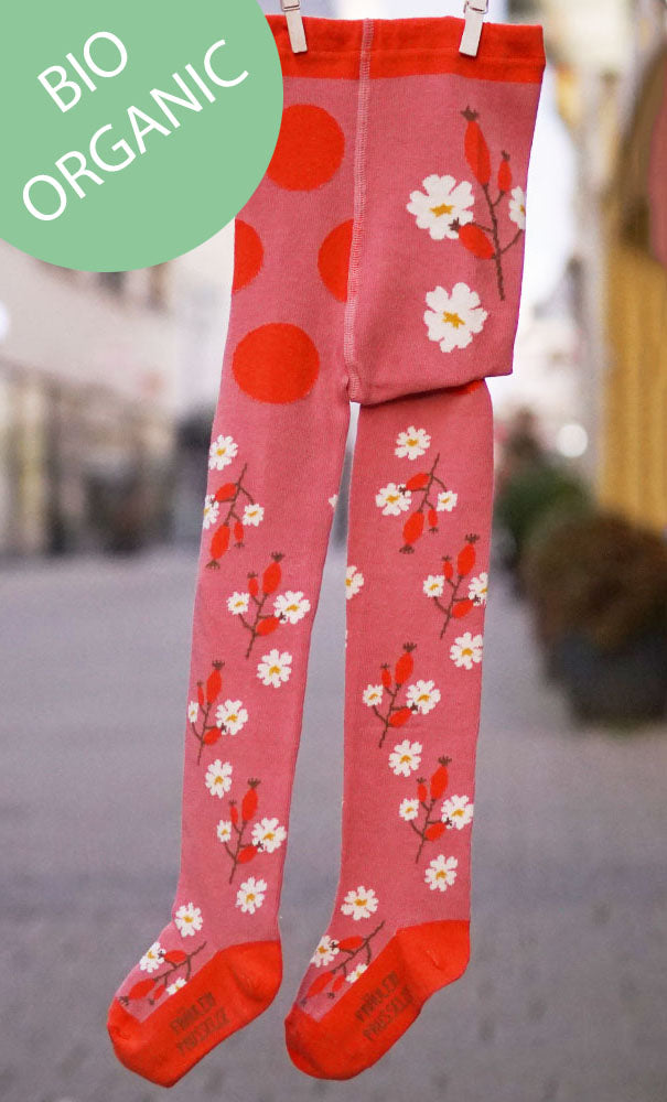 Kinder Strumpfhose aus Biobaumwolle in Pink-Rosa Tönen mit blumigem Hagebutte Motiv und roßen Punkten im Bauchbereich.