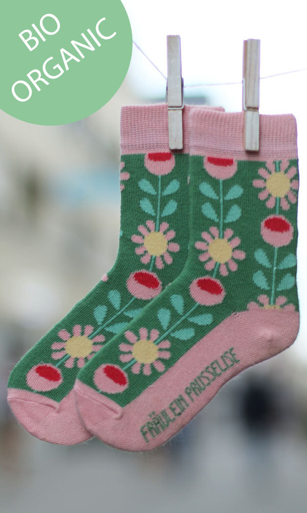Wunderschoene Kindersocken mit Retroblumenmuster in rosa und gruen.