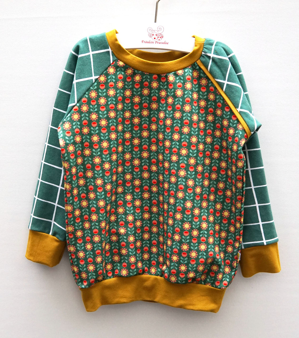 Kinder Sweater Karo retro Blume vorne